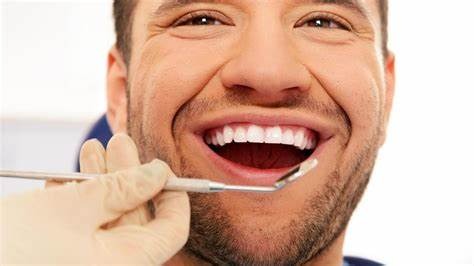 A smiling man comes for Gentle Dentistry